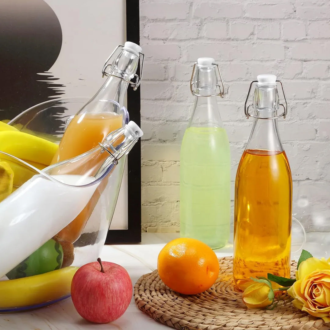 Botella de vidrio con tapa abatible